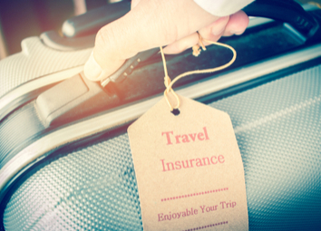 hands-holding-travel-insurance-tag