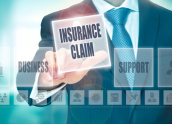 businessman-pressing-insurance-claim-button