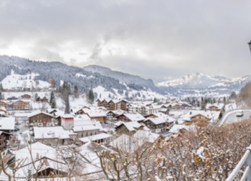 gstaad-covered-snow-swiss-mountain-village