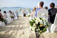 Seashell bouquets and starfish decor set the mood for a beach wedding