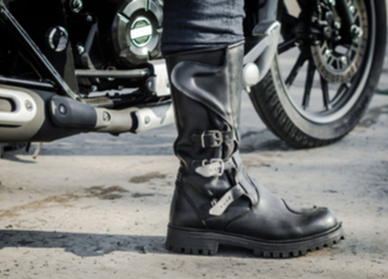 biker-leg-boot-against-backdrop-motorcycle